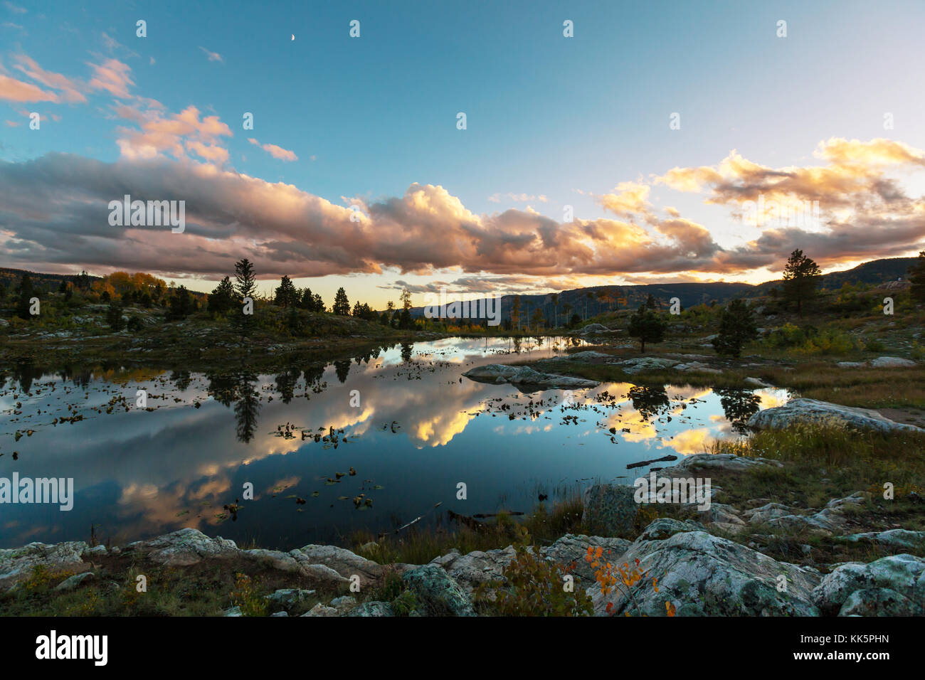 Sunset in mountains Stock Photo - Alamy