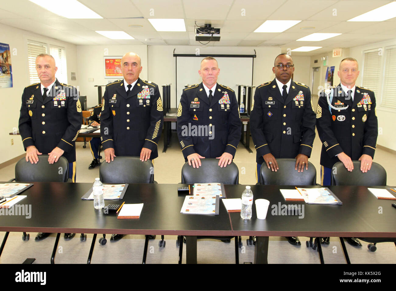 The leaders of the Noncommissioned Officer’s Appearance Board stand prior to questioning a competitor in the 2017-18 California Army National Guard Best Warrior Competition Nov. 5 at Camp San Luis Obispo, California. Shown: Sgt. Maj. Gerald Davis, 143rd Military Police Battalion; Command Sgt. Maj. Richard Munoz, 100th Troop Command; Command Sgt. Maj. Scott Witt, board leader, 115th Regional Support Group; Command Sgt. Maj. Roddrick Pullen, 40th Brigade Support Battalion; and Command Sgt. Maj. William Black, 185th Infantry Battalion. (Army National Guard photo by Staff Sgt. Eddie Siguenza) Stock Photo