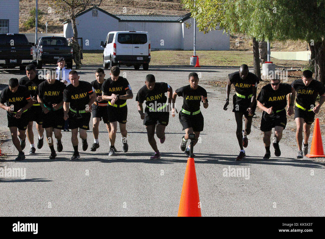 Competitors begin the 2-mile run of the Army Physical Fitness Test Nov. 5 during the 2017-18 California Army Nationl Guard Best Warrior Competition at Camp San Luis Obispo, California. Participants went through four days of mental and physical challenges to determine the Cal Guard's Soldier and Noncommissioned Officer of the Year. (Army National Guard photo by Staff Sgt. Eddie Siguenza) Stock Photo