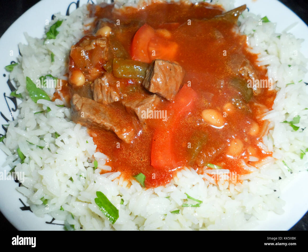 A plate of traditional Turkish White Bean Stew, Etli kuru fasulye, with Orzo pilau rice Stock Photo