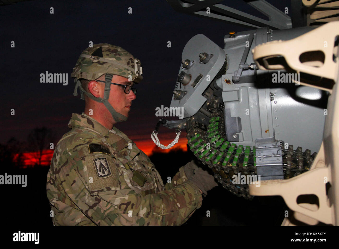 Spc. Alexander Jones, a field artillery firefinder radar operator with Battery A, 2nd Battalion, 44th Air Defense Artillery Regiment, assigned to 108th Air Defense Artillery Brigade, and attached to the 101st Airborne Division (Air Assault) Sustainment Brigade, 101st Abn. Div., checks the ammo on the Land-Based Phalanx Weapon System, Nov. 8, 2017, during the battalion’s live fire exercise on Fort Campbell, Kentucky. (U.S. Army photo by Spc. Alexes Anderson/101st SBDE Public Affairs) Stock Photo