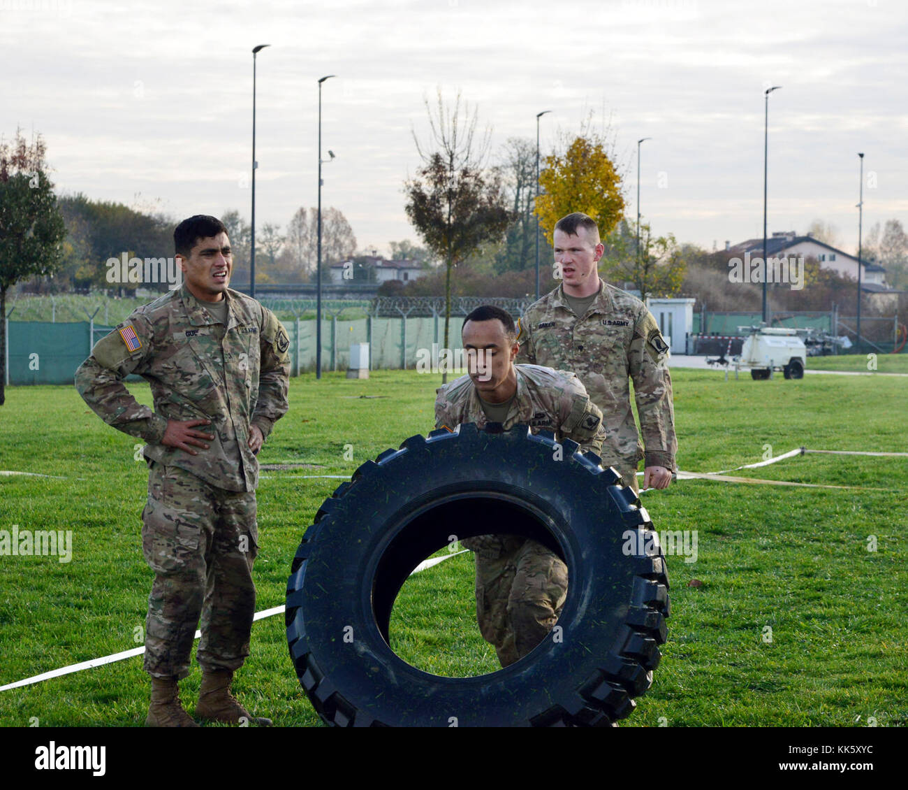 U.S. Army Paratroopers assigned to 2nd Battalion, 503rd Infantry Regiment, 173rd Airborne Brigade, compete in a timed tire-flipping event during a Rockvember Event for Brostrom Challenge, at Caserma Del Din, Vicenza, Italy, Nov. 8, 2017.   The 173rd Airborne Brigade is the U.S. Army Contingency Response Force in Europe, capable of projecting ready forces anywhere in the U.S. European, Africa or Central Commands areas of responsibility within 18 hours.   (U.S. Army photo by Massimo Bovo) Stock Photo