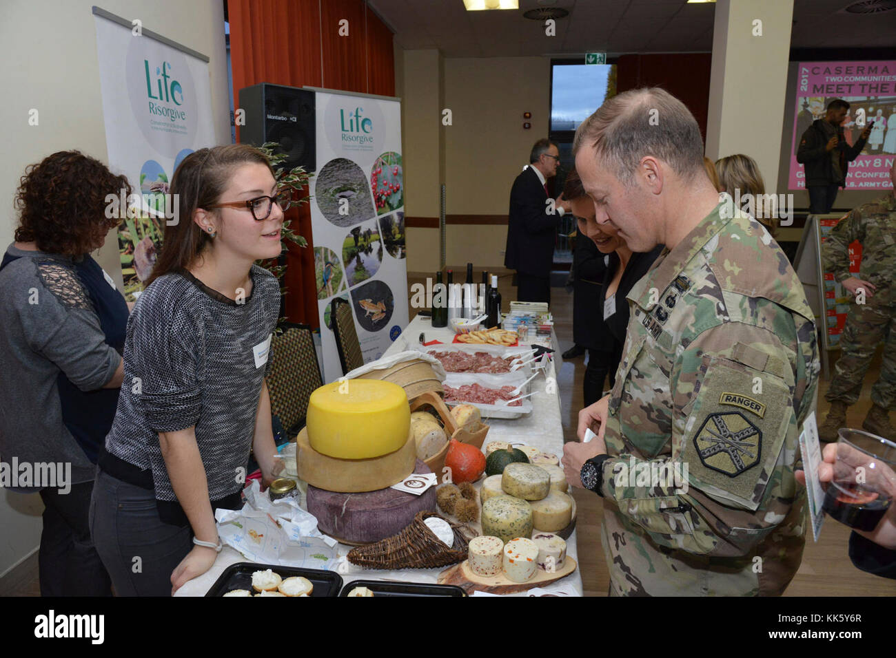 U.S. Col. Eric M. Berdy, U.S. Army Garrison Italy commander, speaks with Manuela Castagna, Barbarano Vicentino community,  during the Meet the Mayors event at the Golden Lion Conference Center on Caserma Ederle, Vicenza, Italy, Nov. 8, 2017.   The event is an informal fair that hosts mayors, council members, and cultural and tourism representatives from Italian townships in the Vicenza and Padova provinces. (U.S. Army Photo by Paolo Bovo) Stock Photo