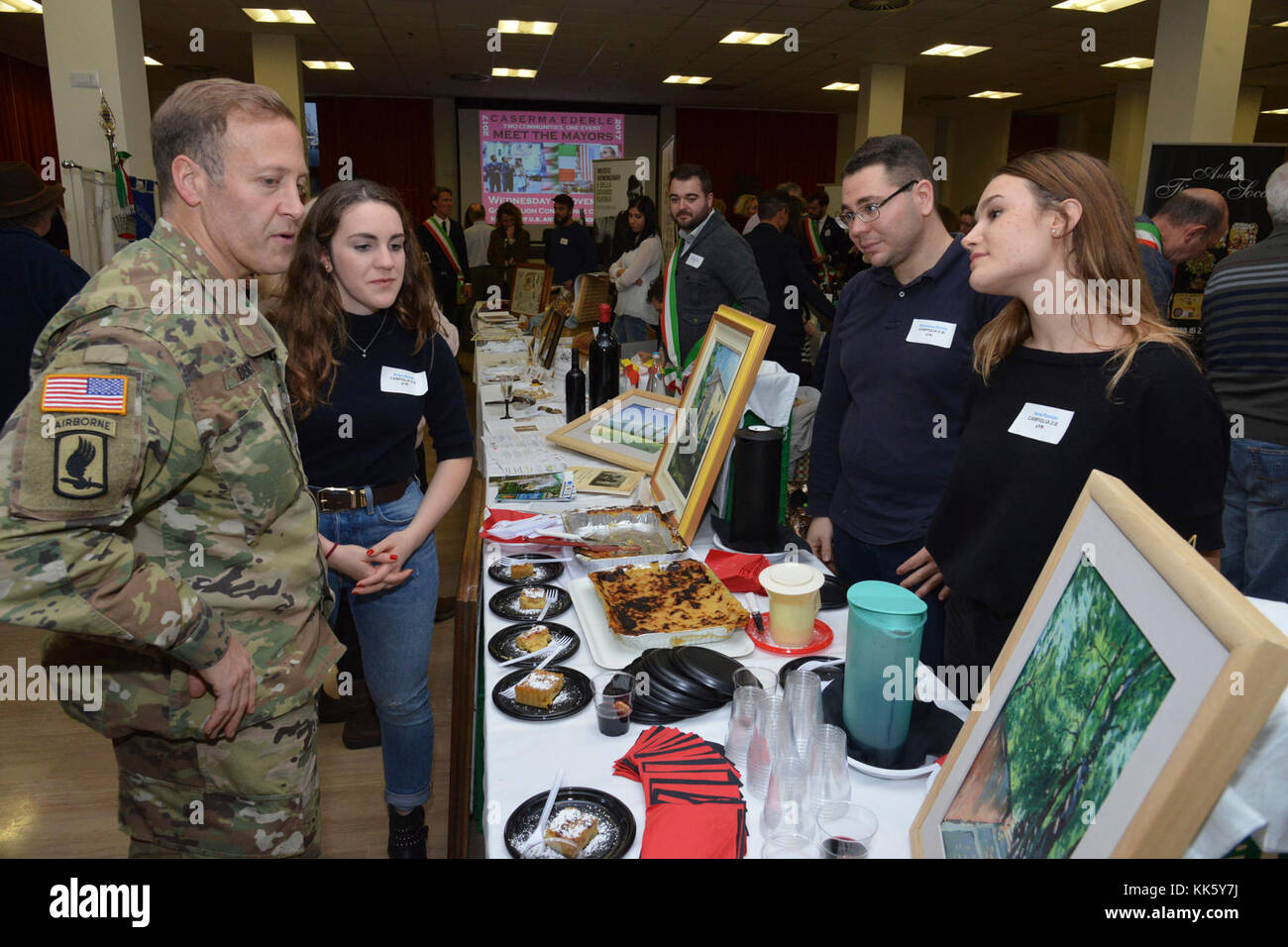 U.S. Col. Eric M. Berdy, U.S. Army Garrison Italy commander, speaks with the members of Campiglia dei Berici community, during the Meet the Mayors event at the Golden Lion Conference Center on Caserma Ederle, Vicenza, Italy, Nov. 8, 2017.   The event is an informal fair that hosts mayors, council members, and cultural and tourism representatives from Italian townships in the Vicenza and Padova provinces. (U.S. Army Photo by Paolo Bovo) Stock Photo