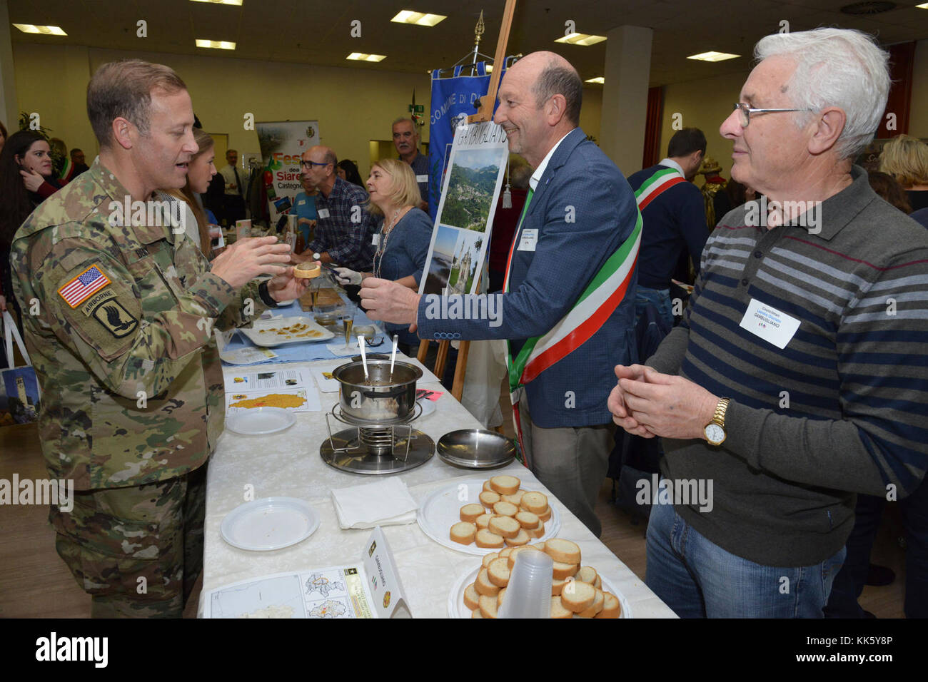 U.S. Col. Eric M. Berdy, U.S. Army Garrison Italy commander, speaks with Diego Maria Santagiuliana, councilman of Gambugliano, during the Meet the Mayors event at the Golden Lion Conference Center on Caserma Ederle, Vicenza, Italy, Nov. 8, 2017.   The event is an informal fair that hosts mayors, council members, and cultural and tourism representatives from Italian townships in the Vicenza and Padova provinces. (U.S. Army Photo by Paolo Bovo) Stock Photo