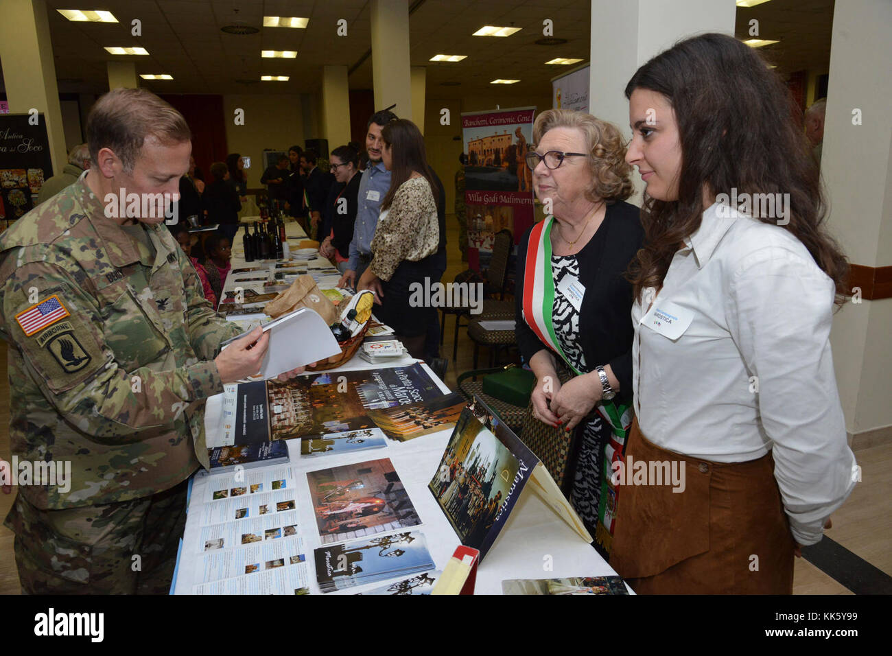 U.S. Col. Eric M. Berdy, U.S. Army Garrison Italy commander, visits with the members of Marostica community exposure, during the Meet the Mayors event at the Golden Lion Conference Center on Caserma Ederle, Vicenza, Italy, Nov. 8, 2017.   The event is an informal fair that hosts mayors, council members, and cultural and tourism representatives from Italian townships in the Vicenza and Padova provinces. (U.S. Army Photo by Paolo Bovo) Stock Photo
