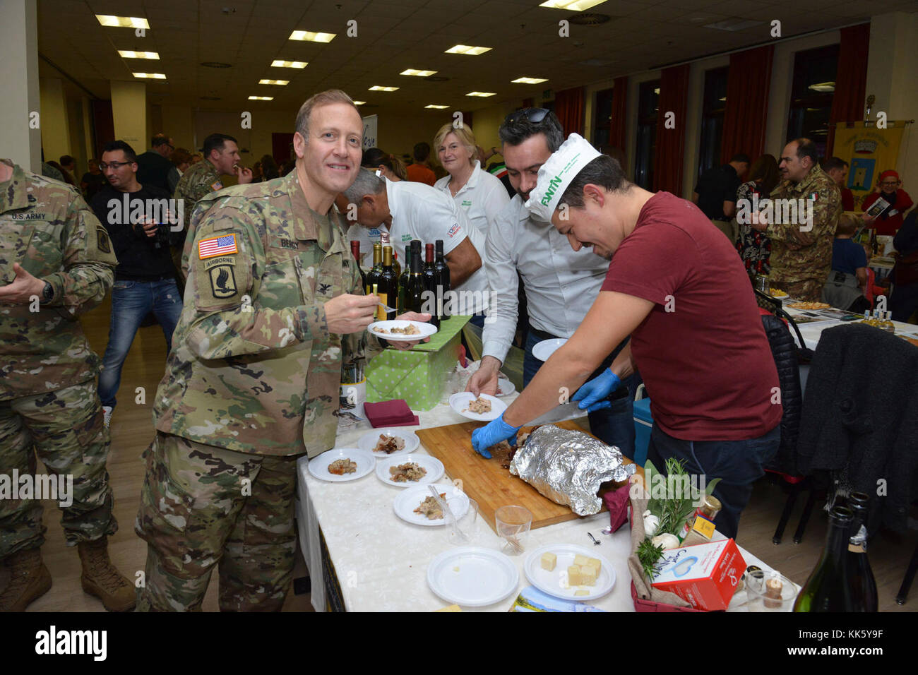 U.S. Col. Eric M. Berdy, U.S. Army Garrison Italy commander, visits the with Monteviale community exposure, during the Meet the Mayors event at the Golden Lion Conference Center on Caserma Ederle, Vicenza, Italy, Nov. 8, 2017.   The event is an informal fair that hosts mayors, council members, and cultural and tourism representatives from Italian townships in the Vicenza and Padova provinces. (U.S. Army Photo by Paolo Bovo) Stock Photo