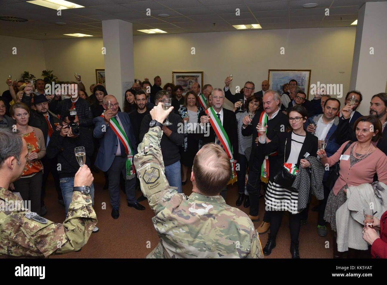 U.S. Col. Eric M. Berdy, U.S. Army Garrison Italy commander, toast with participants at the annual Meet the Mayors event at the Golden Lion Conference Center on Caserma Ederle, Vicenza, Italy, Nov. 8, 2017.   The event brings the American and Italian communities together and gives Italian locals an opportunity to share their cultural heritage with the military community. (U.S. Army Photo by Paolo Bovo) Stock Photo
