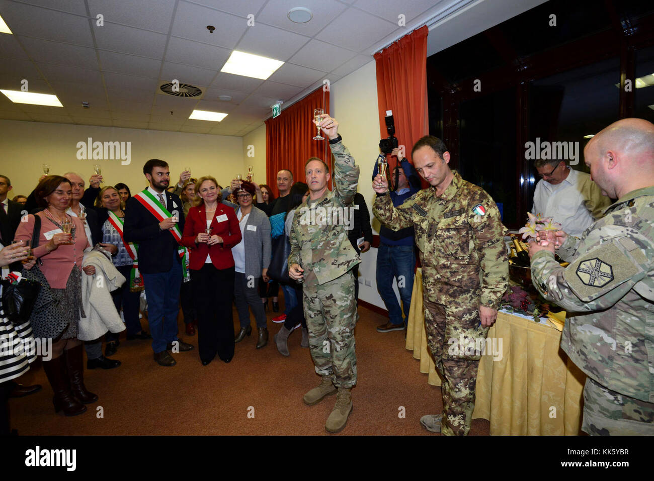 U.S. Col. Eric M. Berdy, U.S. Army Garrison Italy commander, toast with participants at the annual Meet the Mayors event at the Golden Lion Conference Center on Caserma Ederle, Vicenza, Italy, Nov. 8, 2017.   The event brings the American and Italian communities together and gives Italian locals an opportunity to share their cultural heritage with the military community. (U.S. Army Photo by Paolo Bovo) Stock Photo