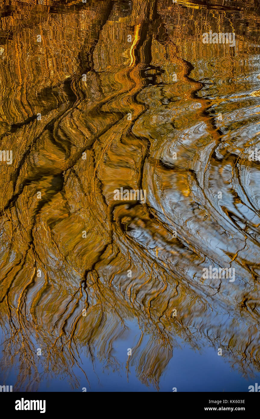 Reflection of houses in the water of the river. Abstract pattern ...