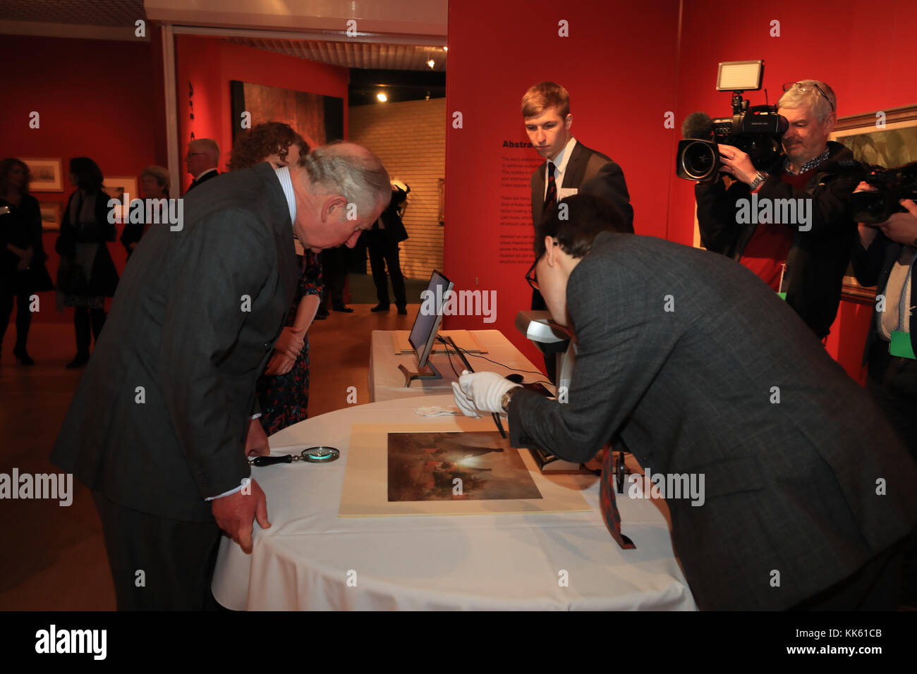 The Prince of Wales looks at a watercolour painting being scanned and digitalised at the Potteries Museum in Stoke-on-Trent. Stock Photo