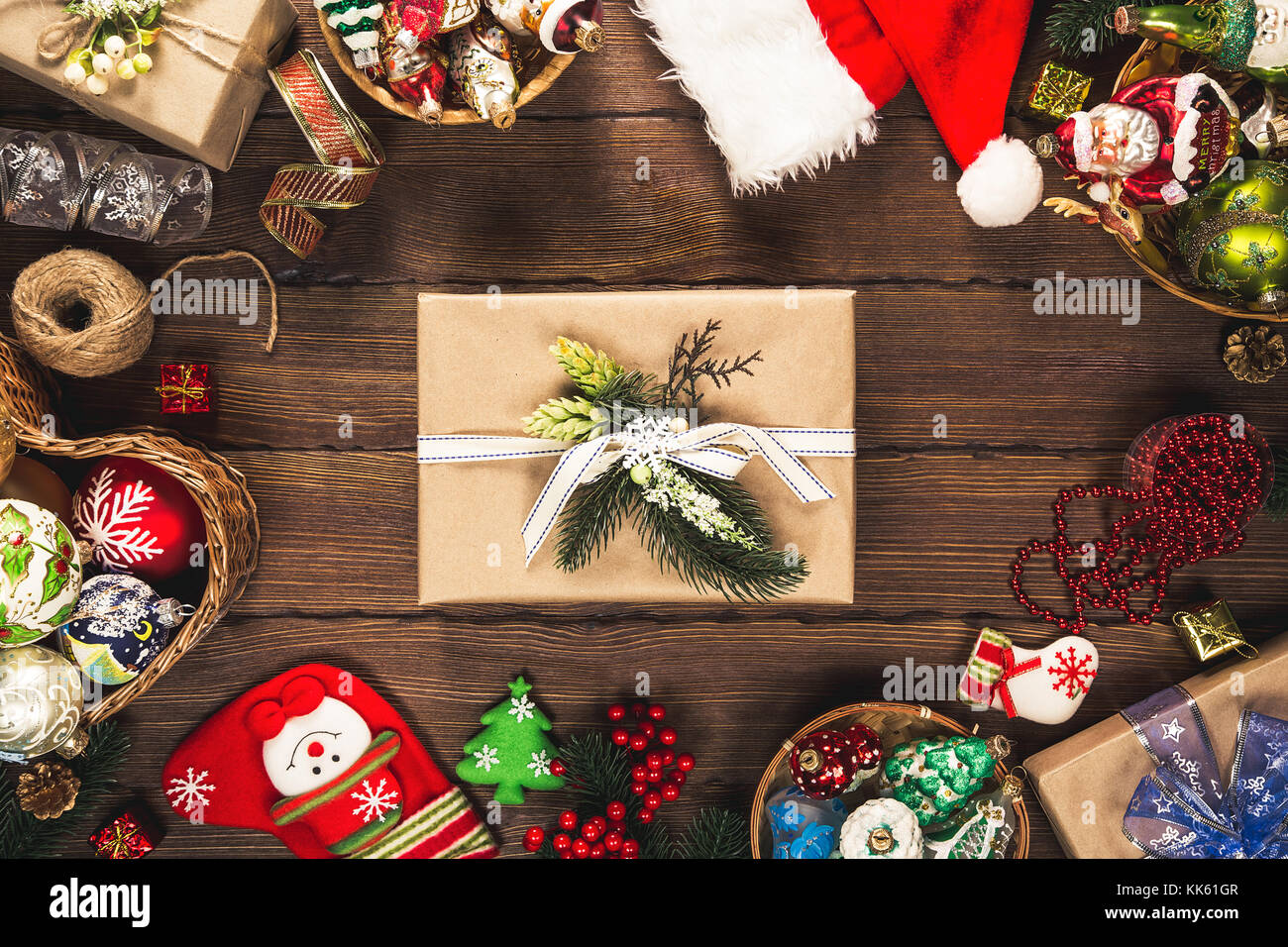 Christmas  background with decorations and gift boxes, balls, toy on vintage old wooden board. Beautiful xmas frame. Idea for advertising, posters, fl Stock Photo
