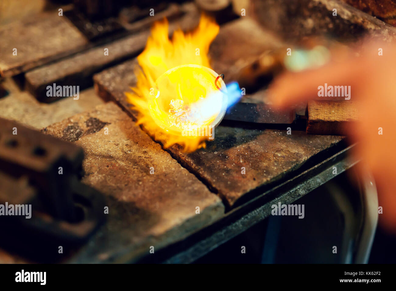 Goldsmith melting metal Stock Photo Alamy