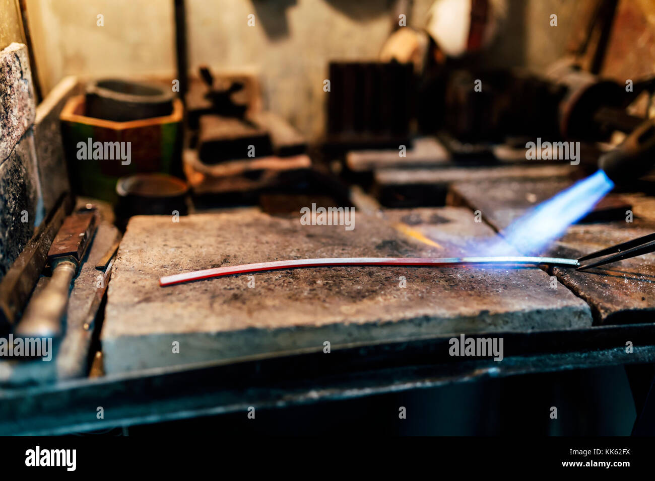 Jeweler processing metal bar Stock Photo Alamy