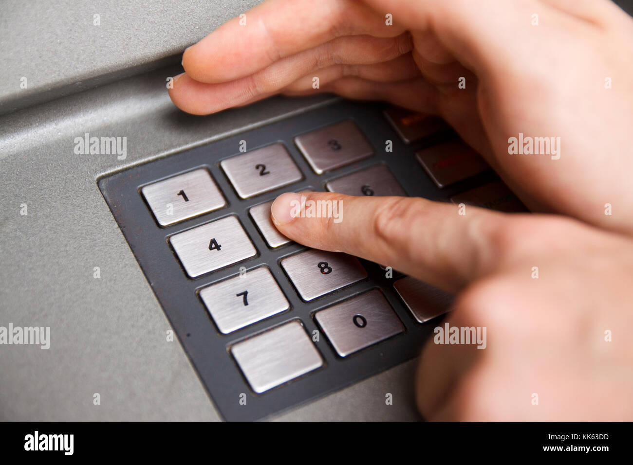 Male hand typing security code white he hides it with other hand Stock ...