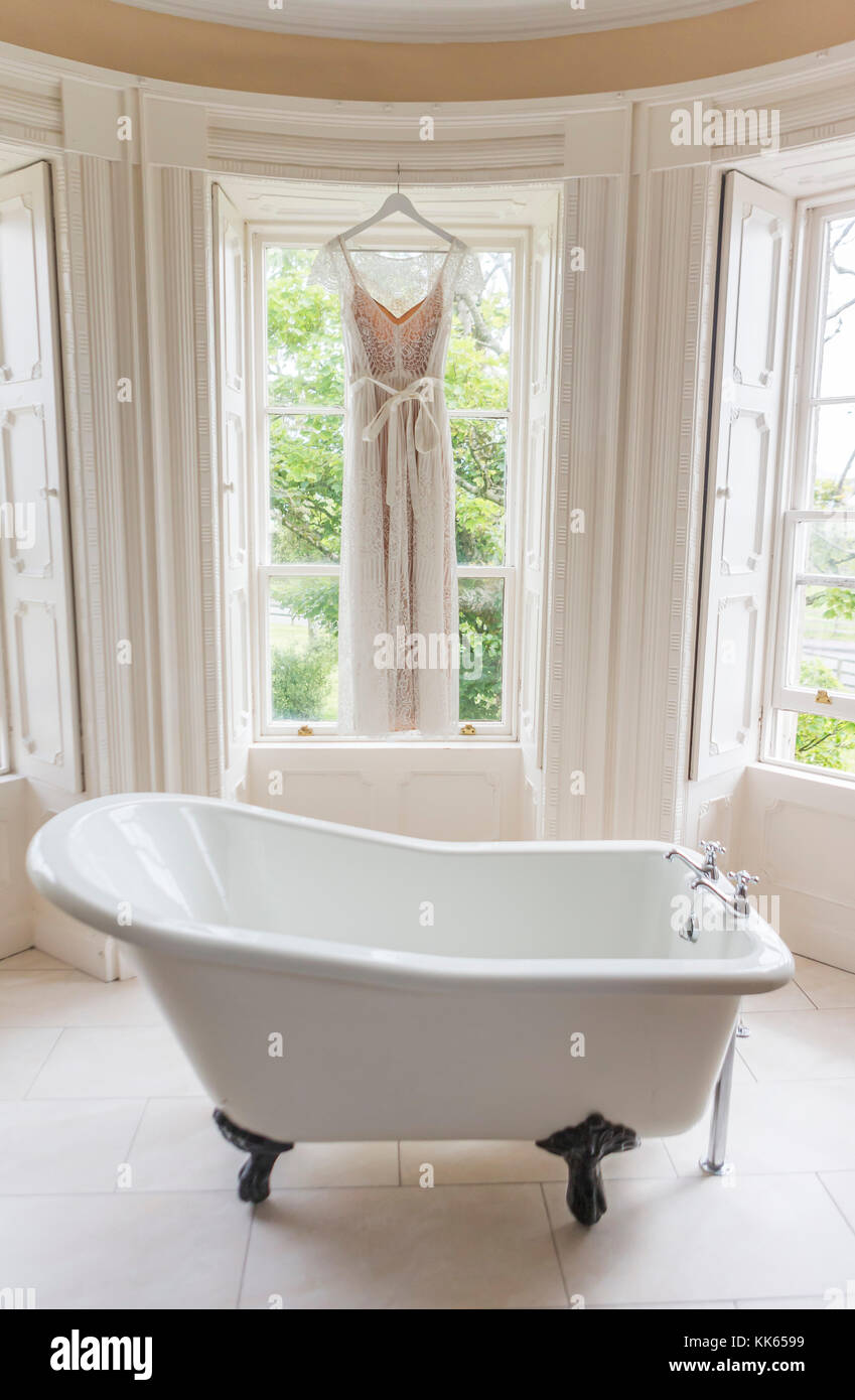 wedding dress in bathroom Stock Photo - Alamy