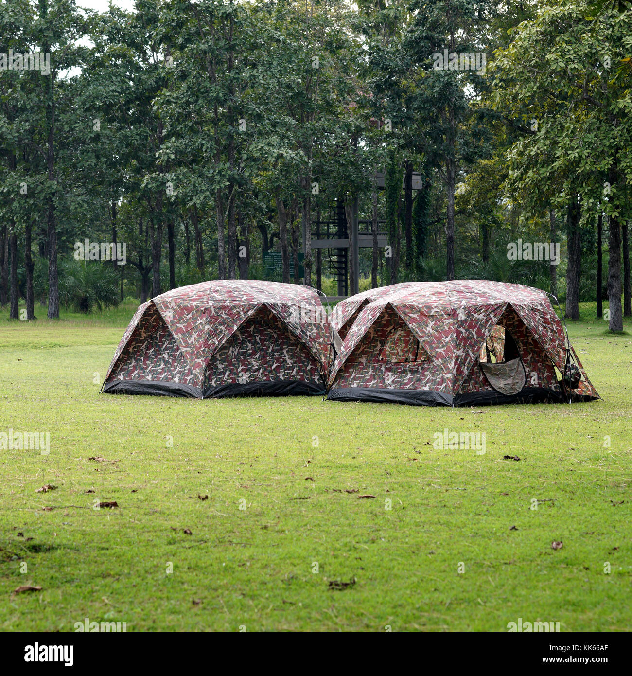 camping tents at the outdoor camp site with tree background Stock Photo ...