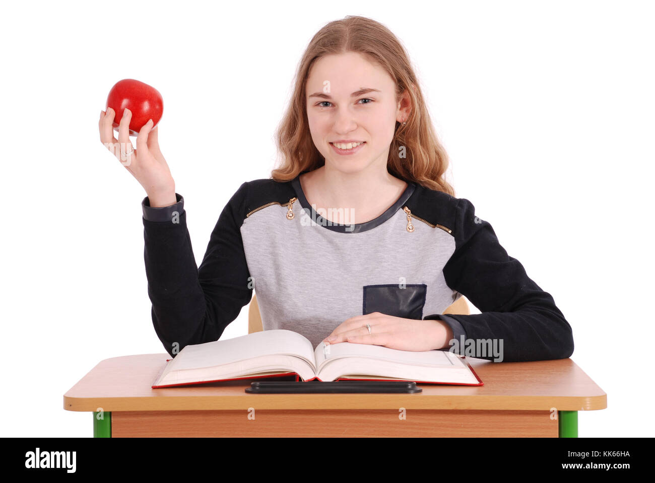 School girl sitting at a desk isolated on white Stock Photo - Alamy