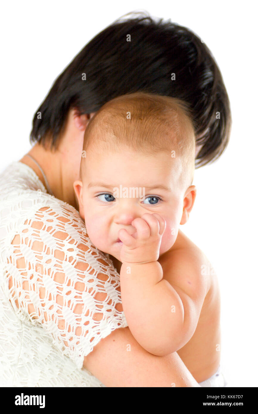 Baby chewing finger holded by mother isolated on white Stock Photo Alamy