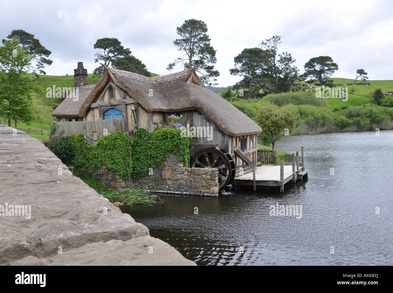 MATAMATA - NEW ZEALAND - NOVEMBER 2016 : Watermill at Hobbiton Movie Set created for filming the Lord of the Rings and Hobbit movies. Stock Photo