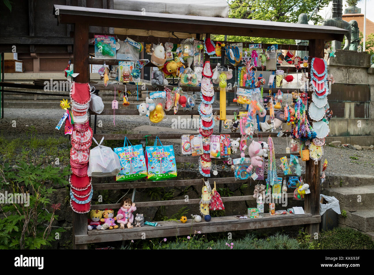 Nagano, Japan -  June 3, 2017: Colorful offerings an dtoys for the patron deity for children and travellers at the Zenkoji temple Stock Photo