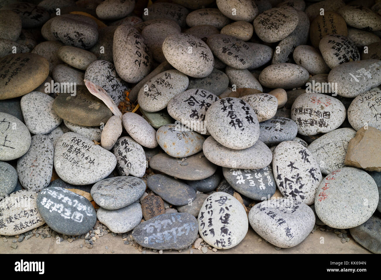 Nagano, Japan - June 5, 2017:  Special type of Ema,  wishes and prayers written on pebble stones Stock Photo