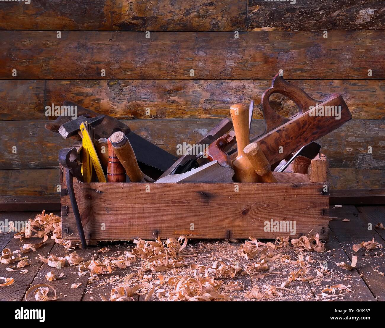 Old toolbox on the workbench in a carpentry Stock Photo