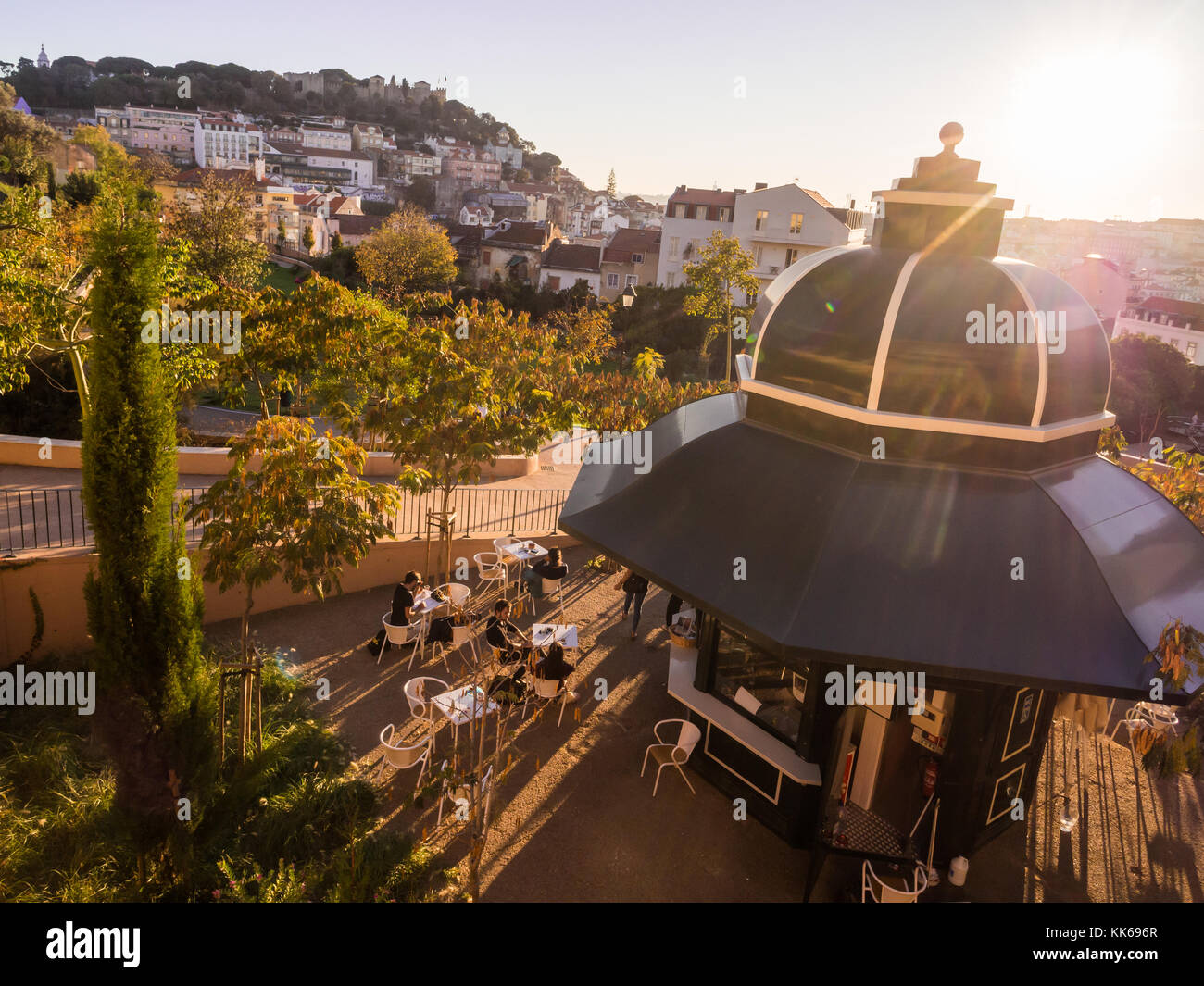 LISBON, PORTUGAL - NOVEMBER 19, 2017: Jardim da Cerca da Graca in Lisbon, Portugal, at sunset. Sao Jorge castle in the background. Stock Photo