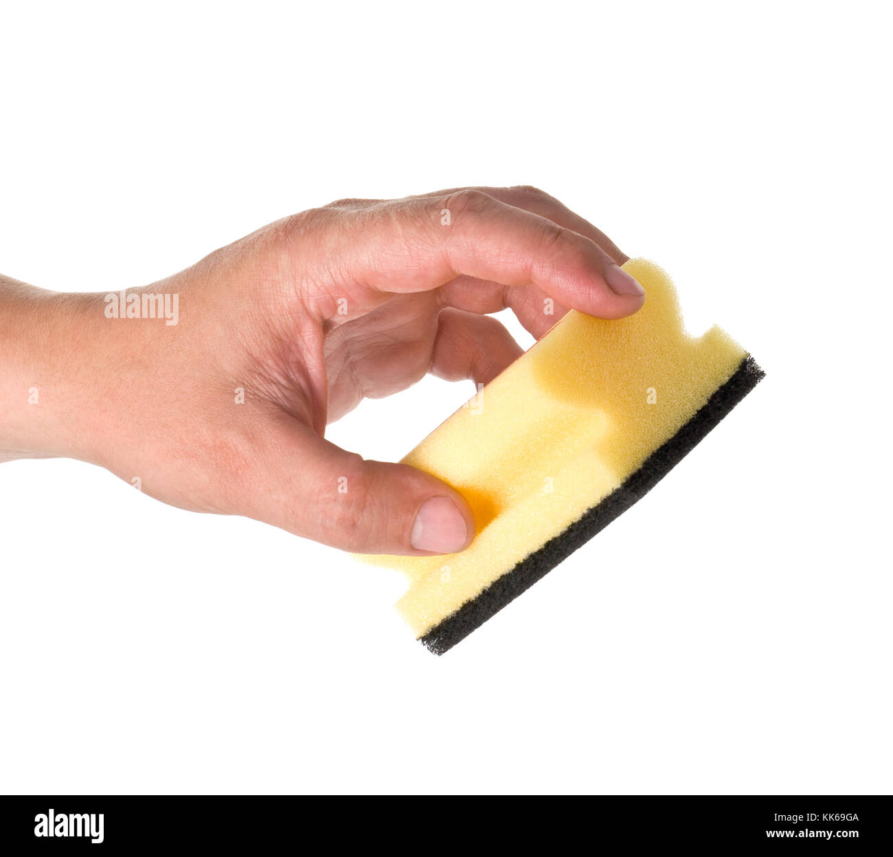 Household sponge in a hand on a white background Stock Photo