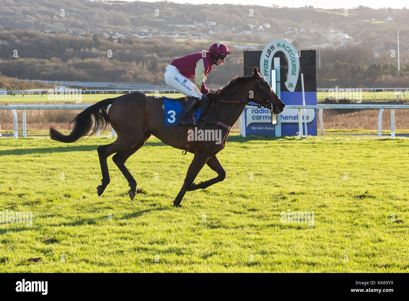 Racehorse Sykes, jockey Matt Griffiths, passes the winning post at Ffos Las Stock Photo