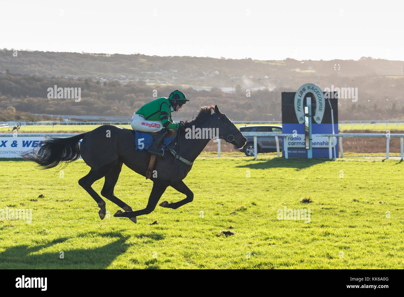 Racehorse Fiscal Space, jockey  Ben Poste, at the finishing post at Ffos Las Stock Photo