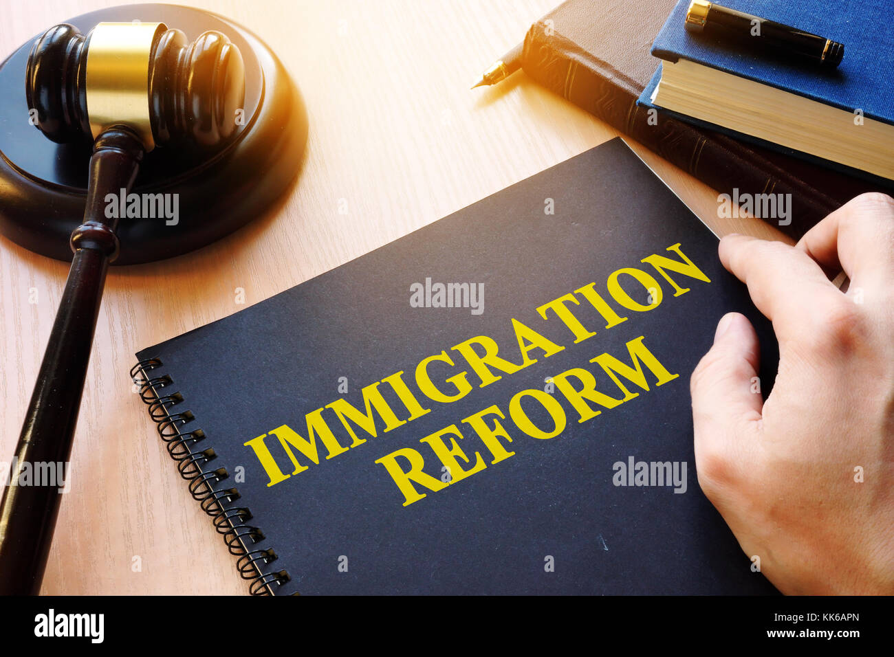 Immigration reform and gavel on a desk. Stock Photo