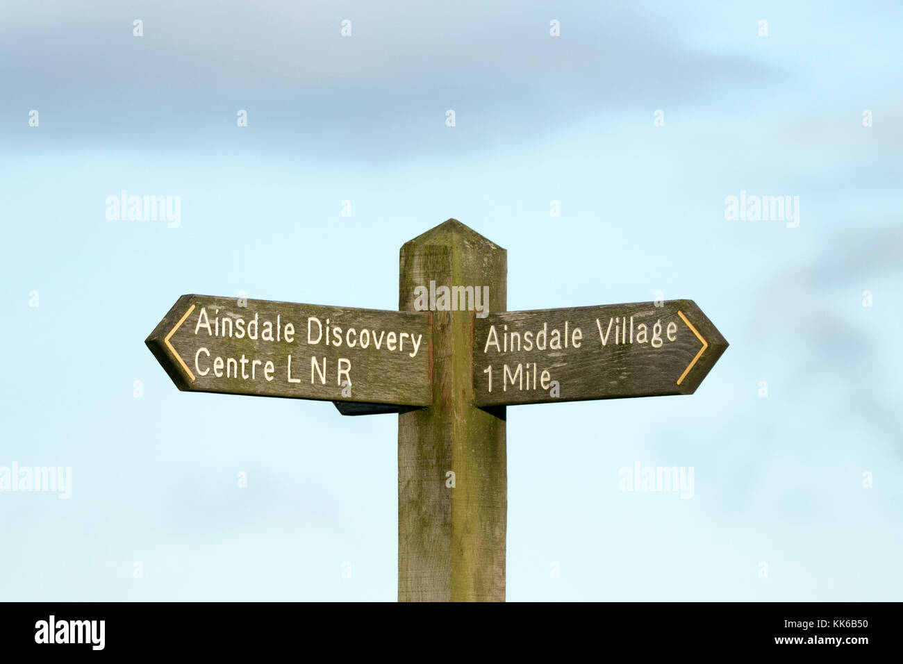 Ainsdale village way marker or directional arrows pointing the