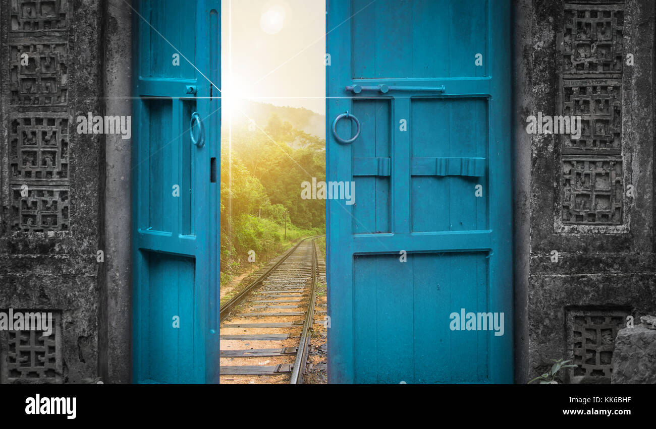 railway tracks behind open door Stock Photo