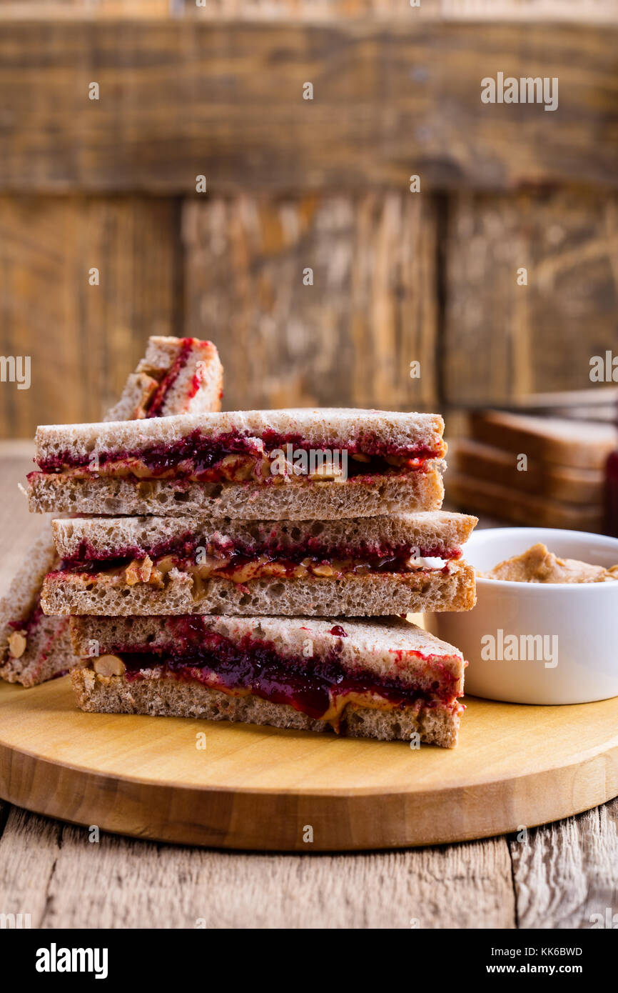 Peanut butter and jelly sandwich with whole wheat bread on rustic wooden table Stock Photo Alamy