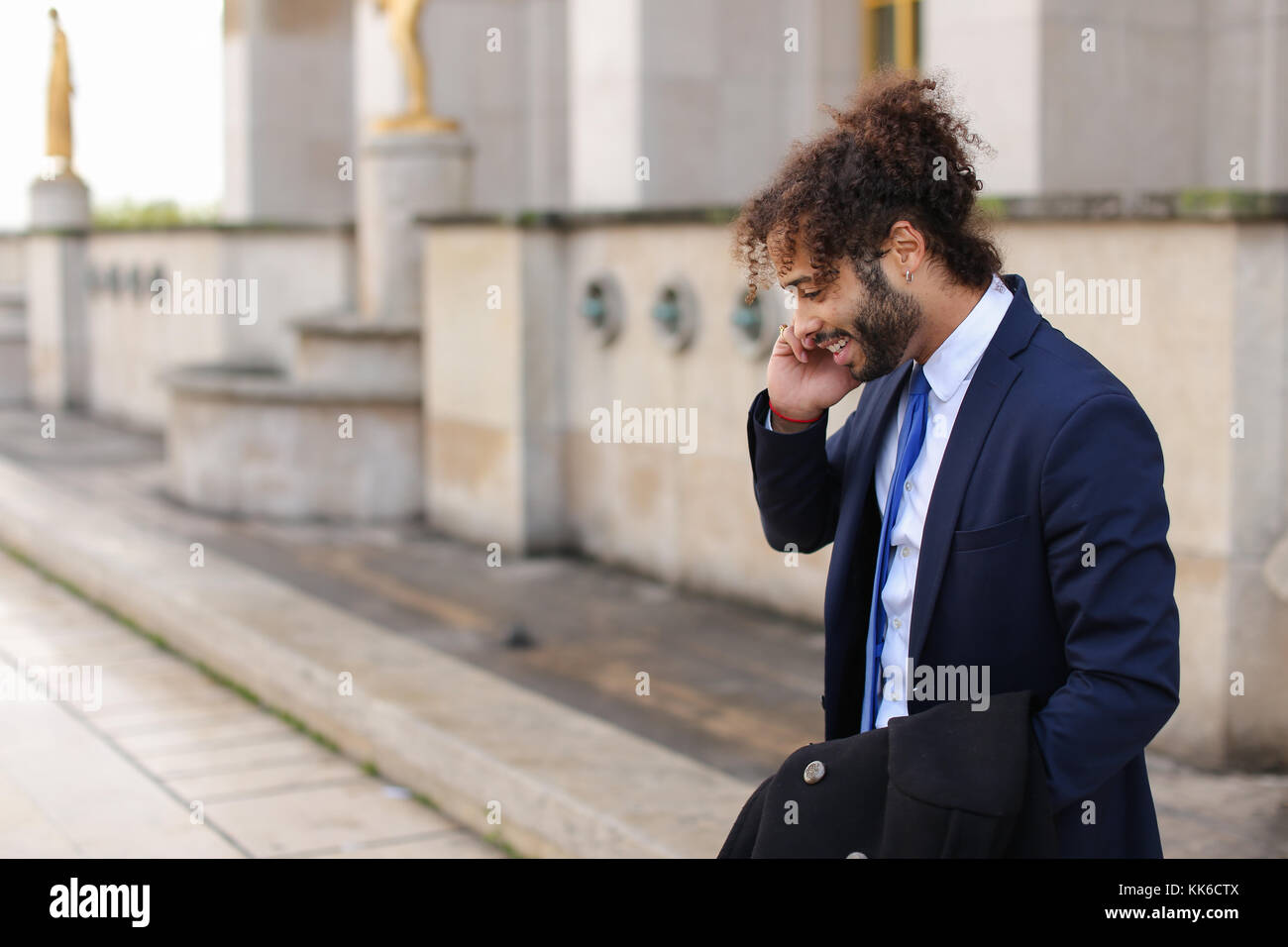 Guy Raving Jocund mulatto guy raving near Eiffel Tower and calling friend b Stock ...