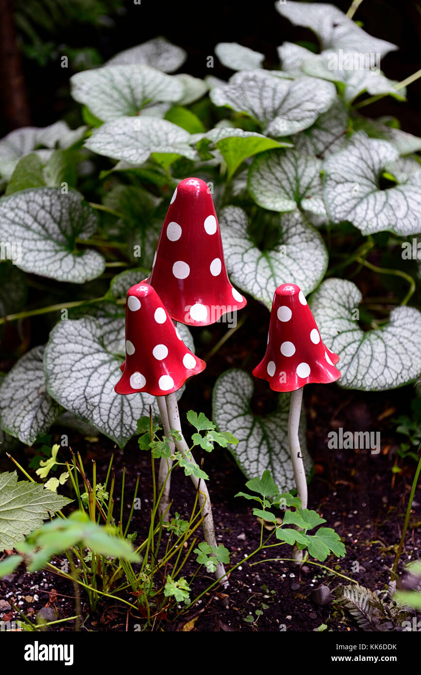 red toadstools, brunnera,fairy garden, fairy, fairies, garden, feature, whimsy, whimsical, magic, magical, childrens garden, child, play, playground,  Stock Photo