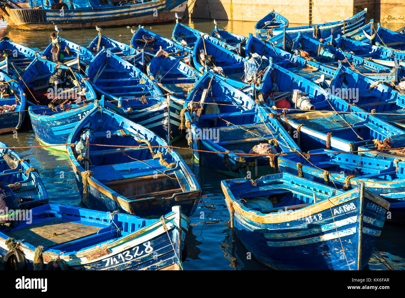 famous blue wooden boats at harbor of Essaouira, Maroc Stock Photo