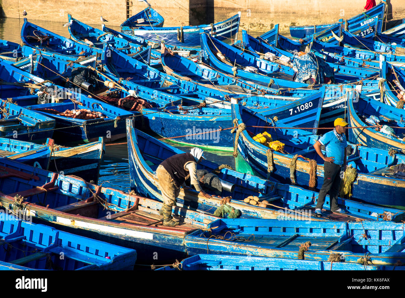 famous blue wooden boats at harbor of Essaouira, Maroc Stock Photo