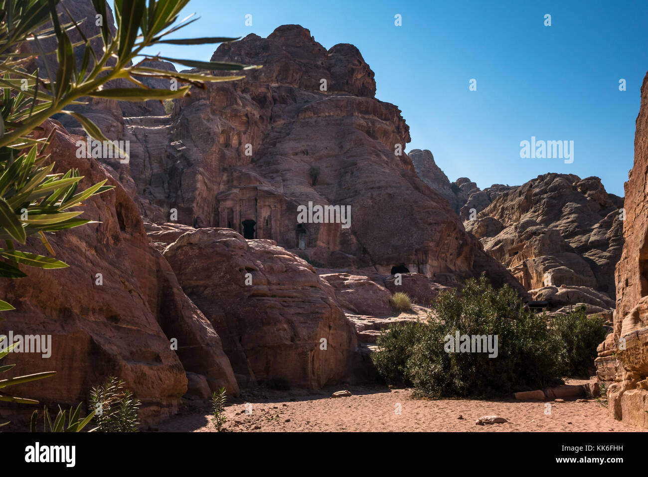 Walking route from High Place of Sacrifice through Wadi Farasa with Nabataean tombs carved into hillsides, Petra, Jordan, Middle East Stock Photo
