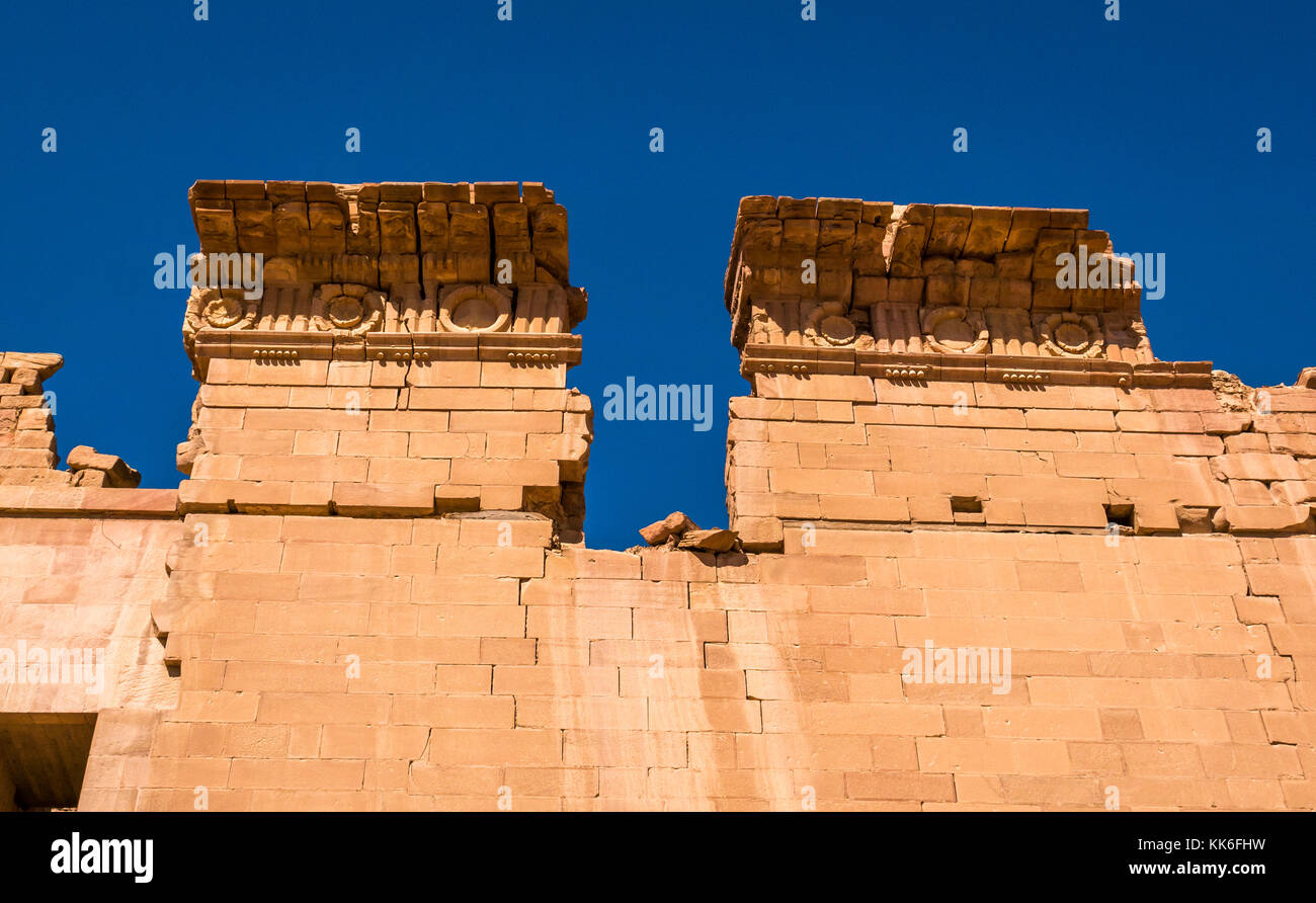 Looking up at detail of carved sandstone topping stones at Temple of Dushara, Petra, Jordan, Middle East Stock Photo