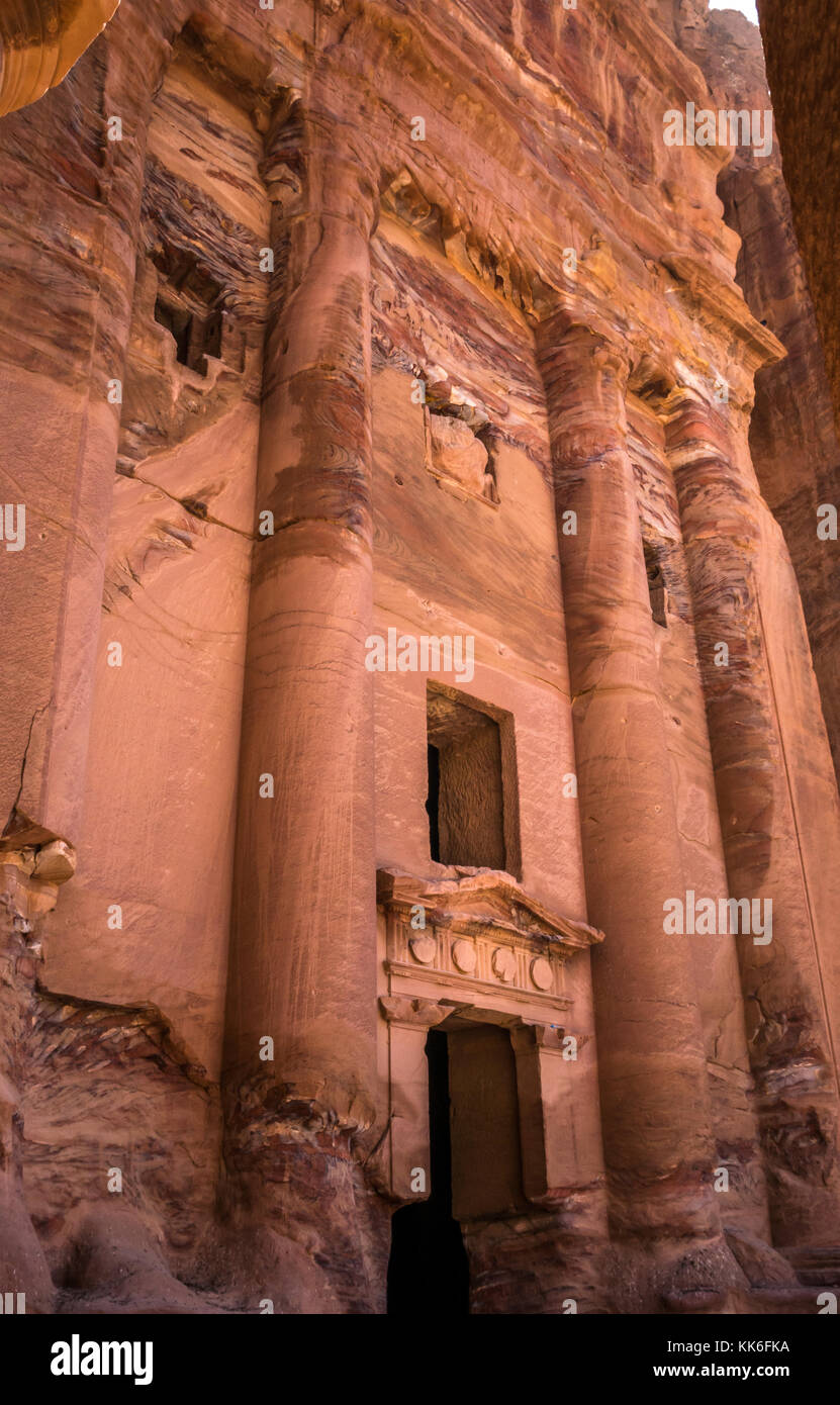 Pink sandstone carved Nabataean Royal Tombs, Petra archaeological site, Jordan, Middle East in early morning light Stock Photo