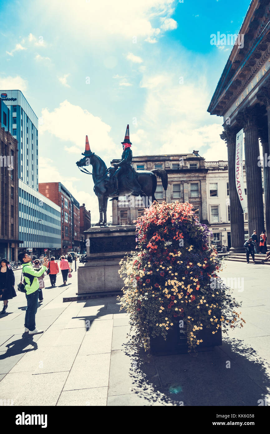 Statue of Duke of Wellington riding a horse, wearing a traffic cone on