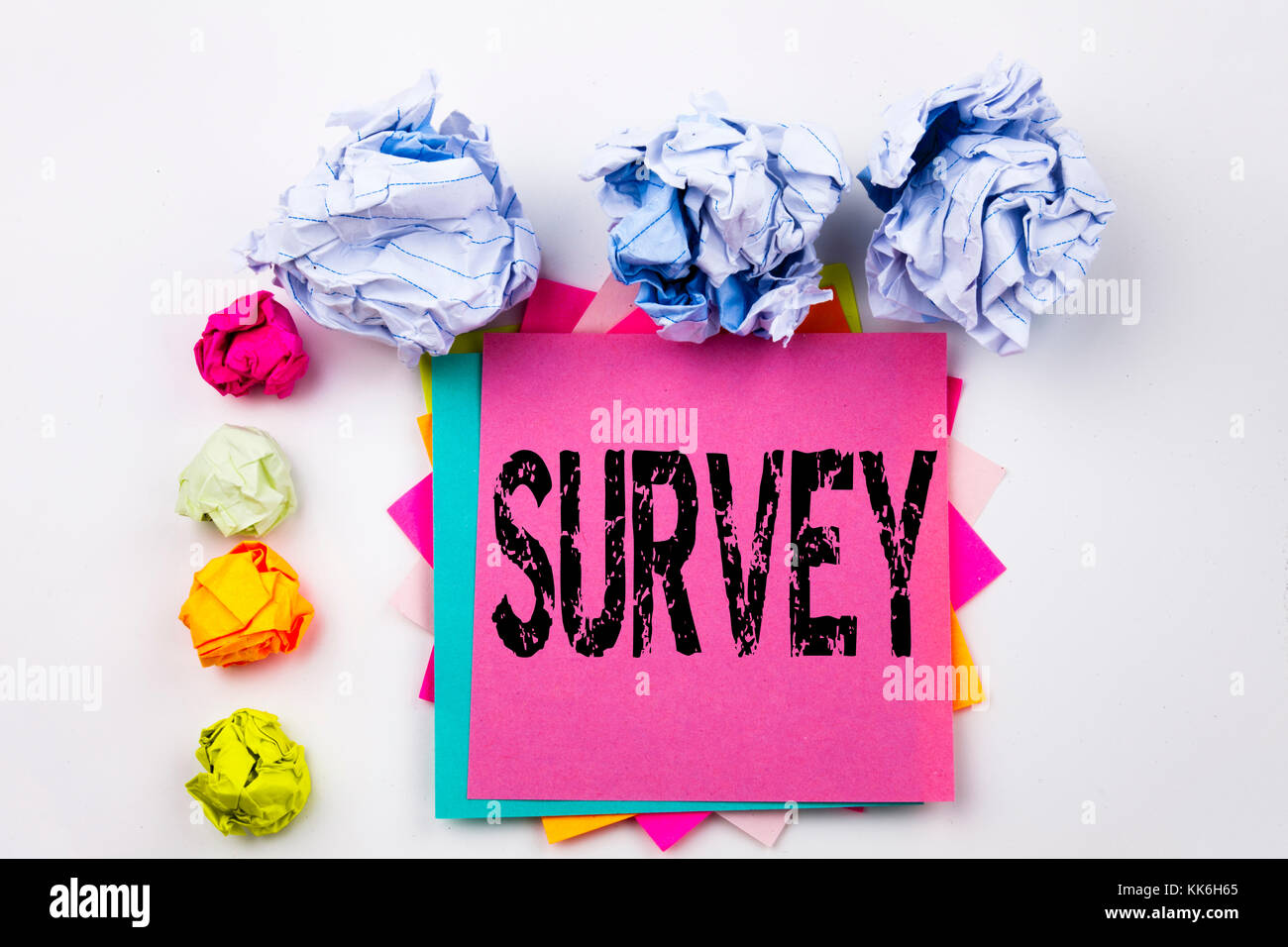 Writing text showing Survey written on sticky note in office with screw ...