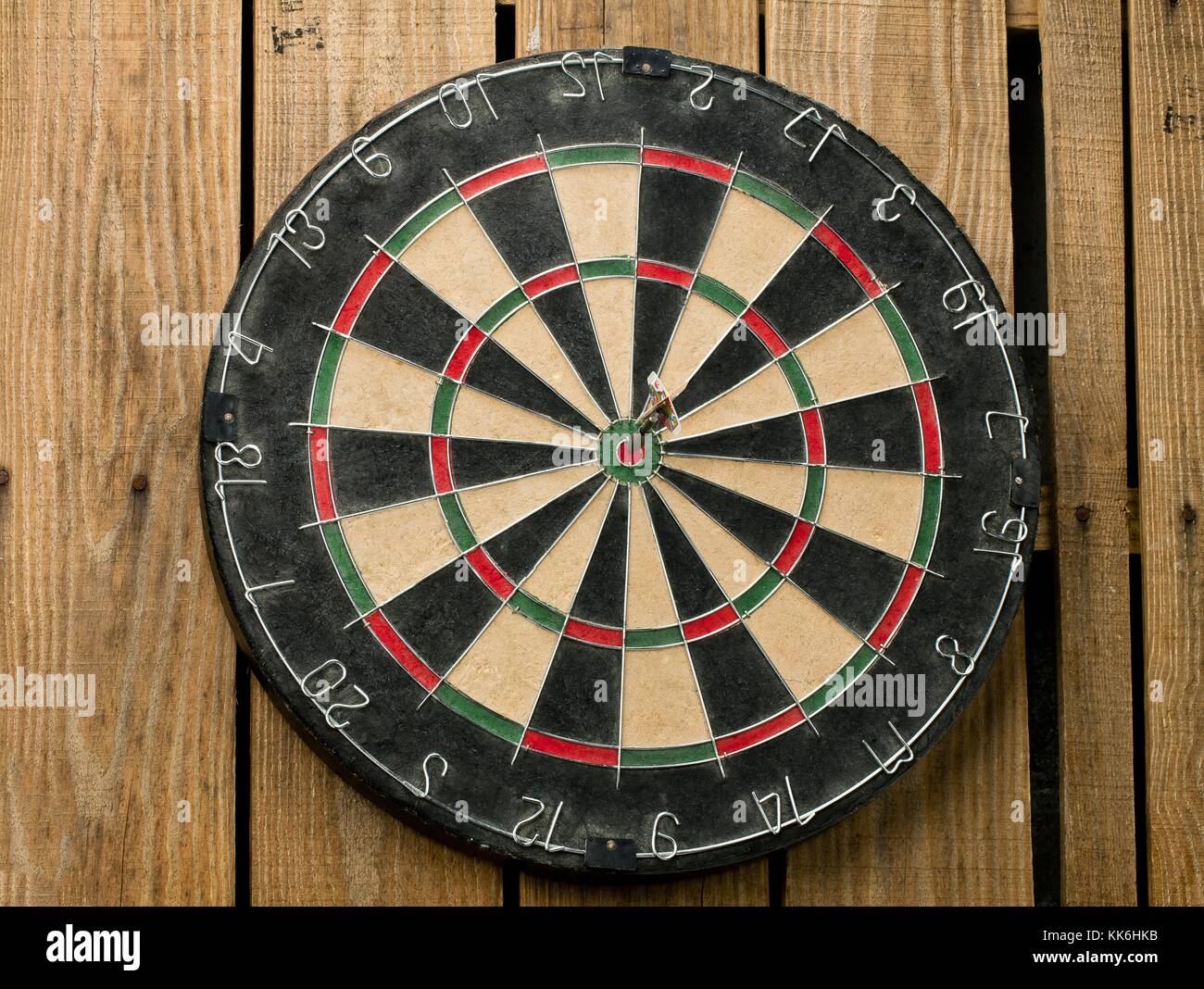 bulls eye pin on the dart board Stock Photo