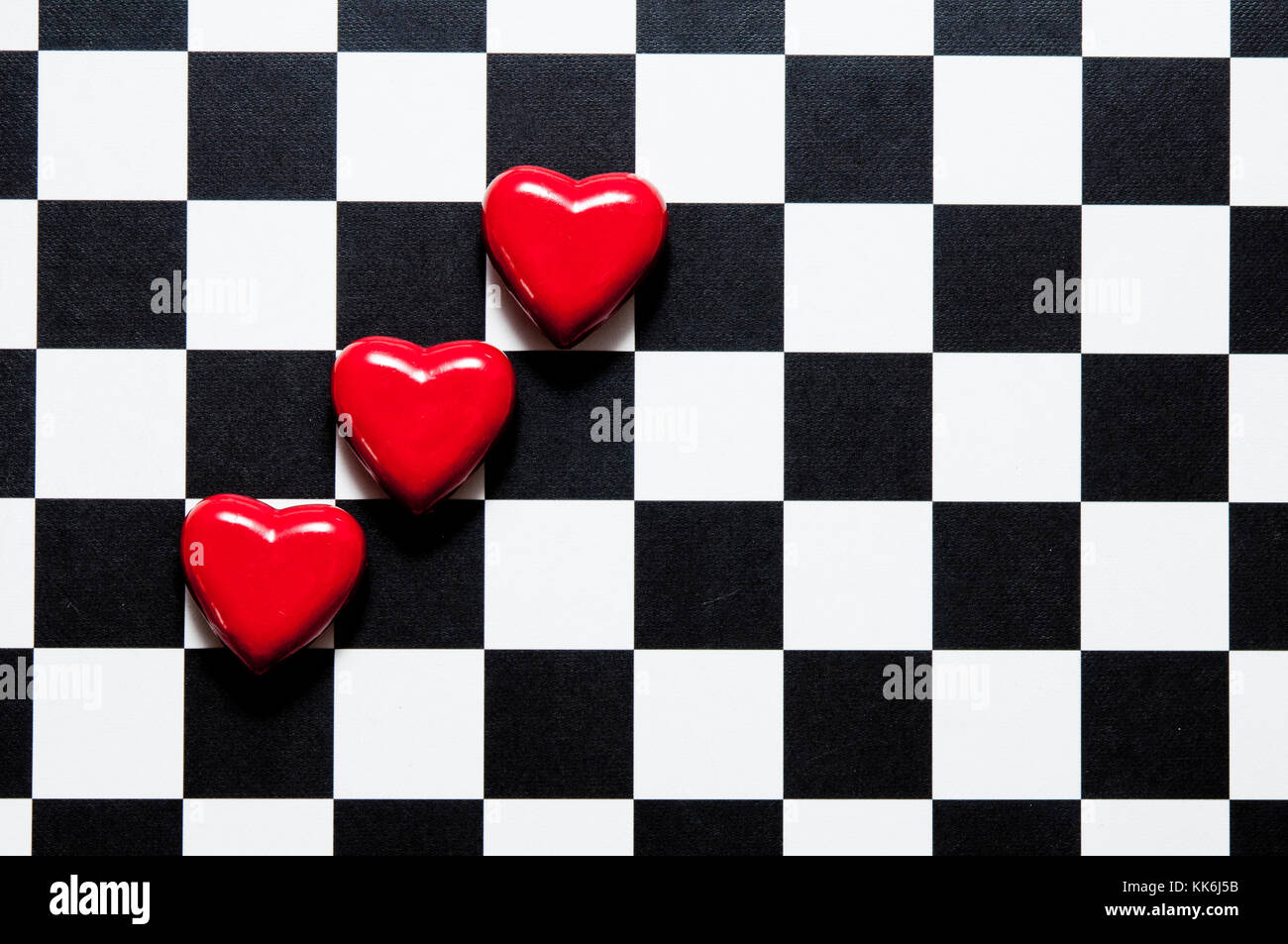 red shaped hearts on a checkerboard Stock Photo