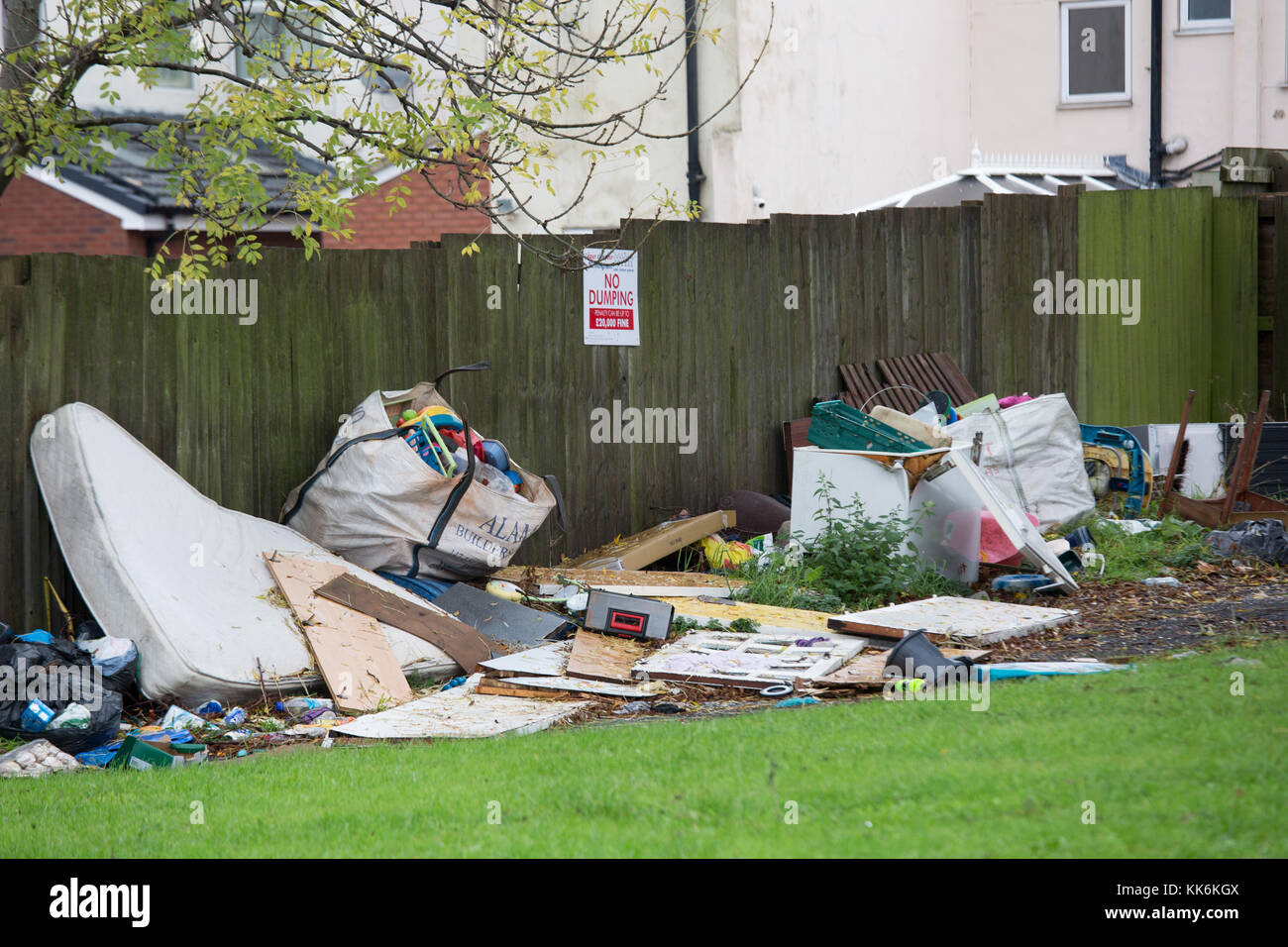 Dumped rubbish under a no dumping sign near Dartmouth Circus, Birmingham. Stock Photo