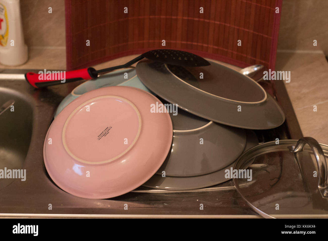 washed dishes and plates and spoons silverware Stock Photo Alamy