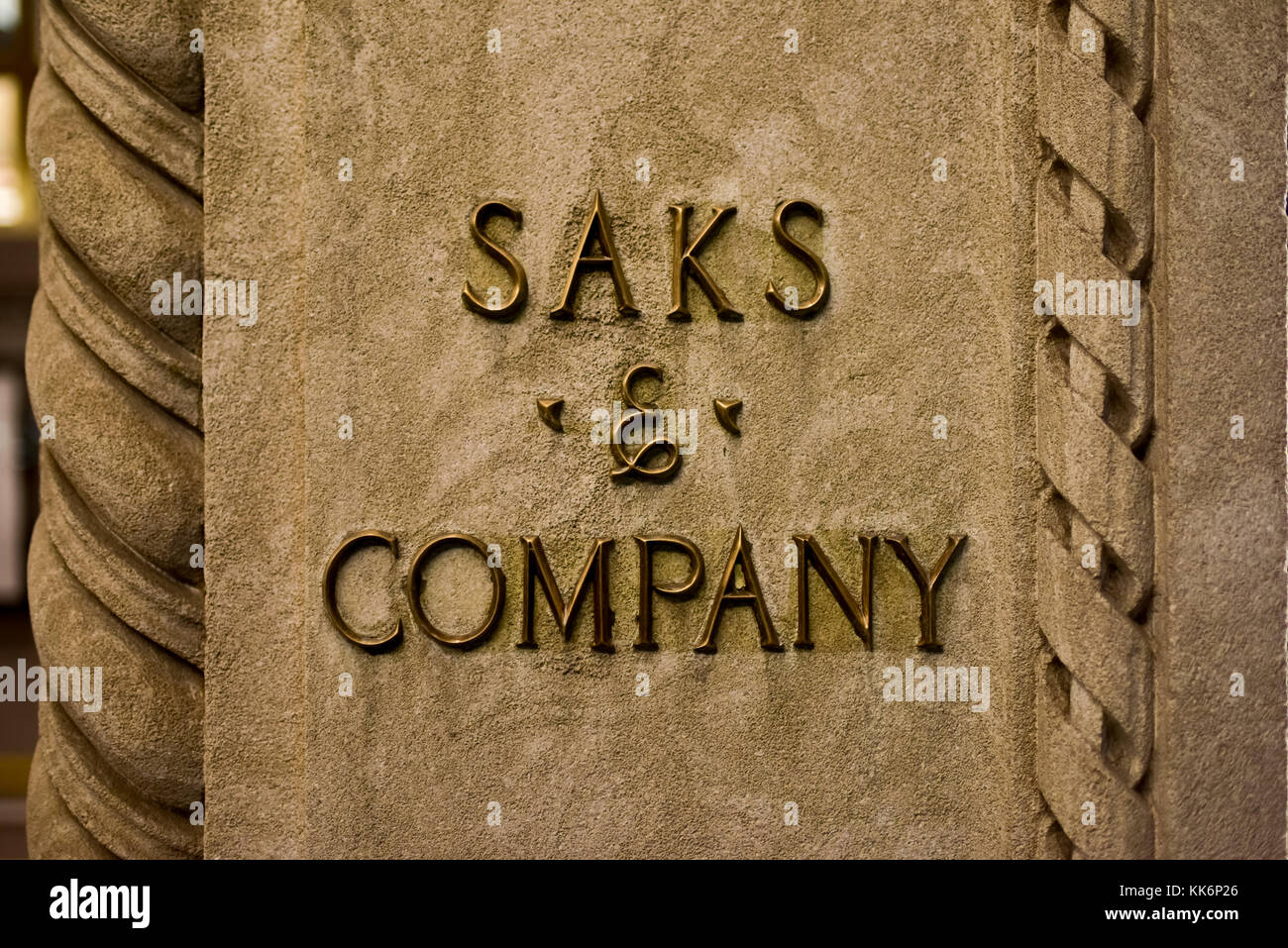 New York, New York - October 29, 2016: Saks and Company signage on the flagship Fifth Avenue store of high end department store Saks Fifth Avenue. The Stock Photo