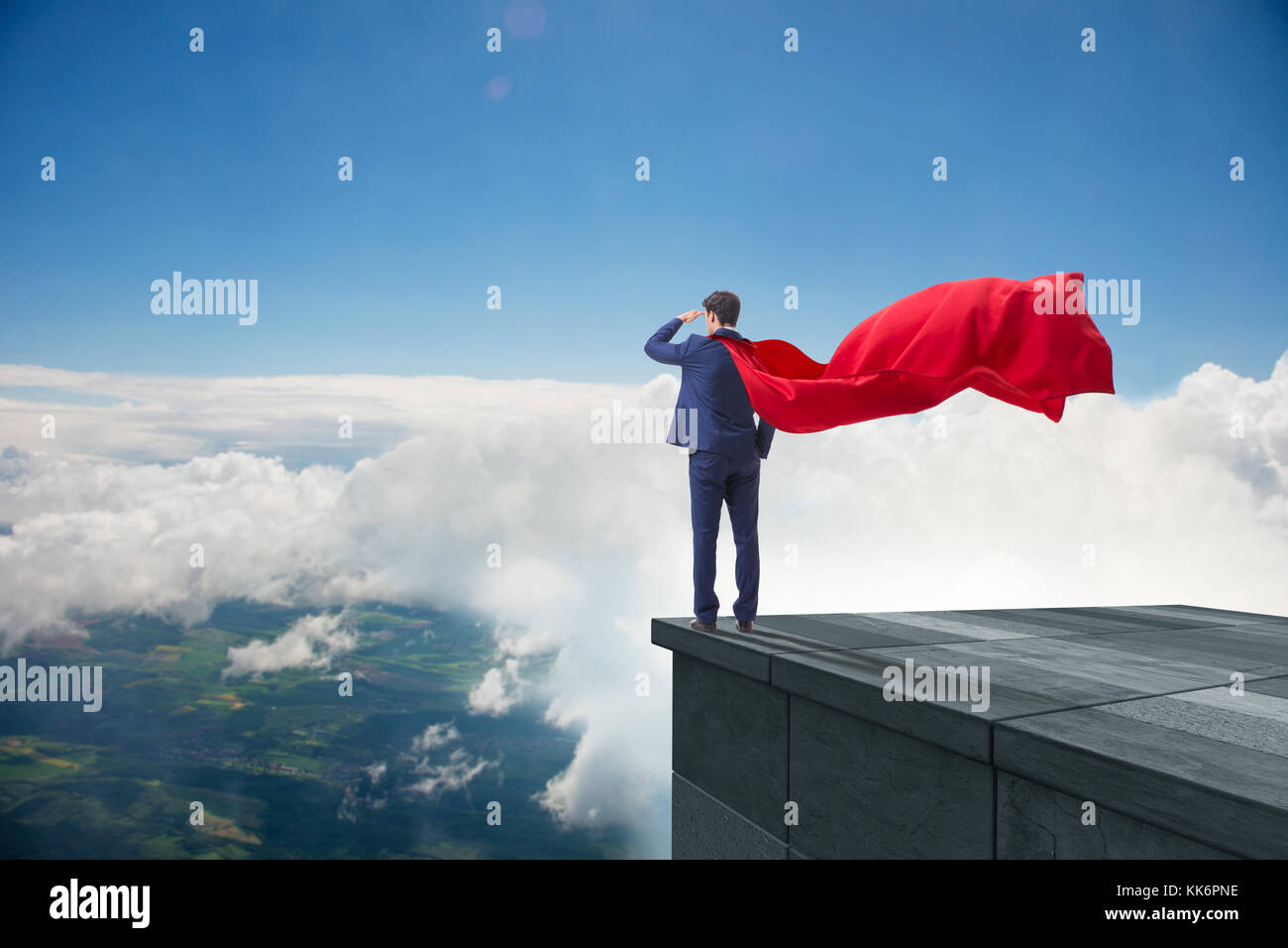 Super hero businessman on top of building ready for challenge Stock ...